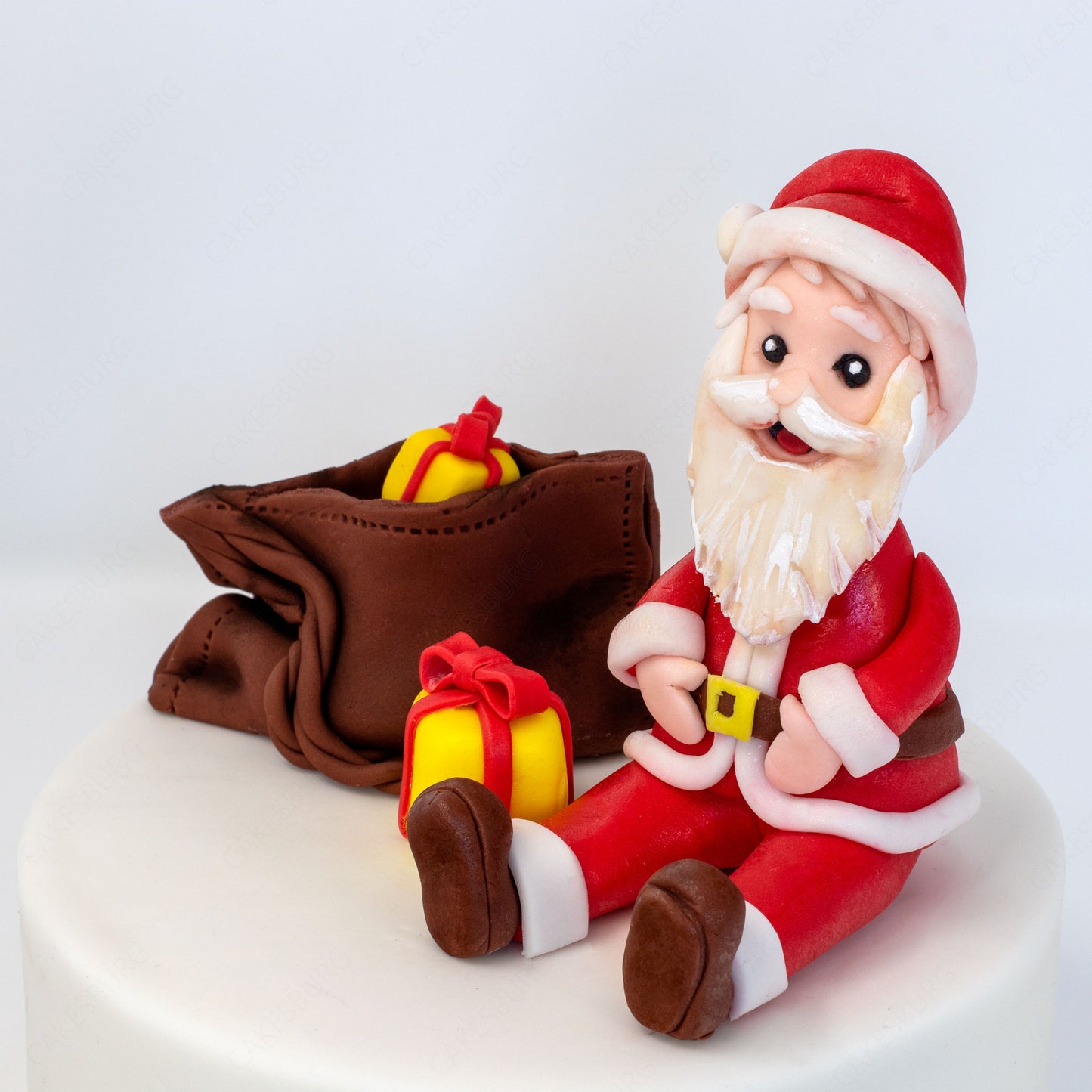 Edible Fondant Sitting Santa Clause with Gift Bag Cake Topper