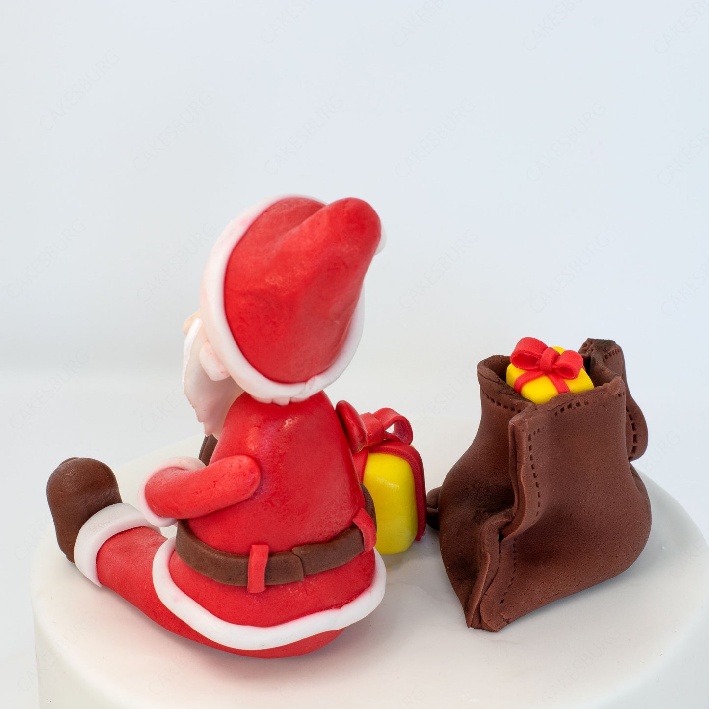 Edible Fondant Sitting Santa Clause with Gift Bag Cake Topper