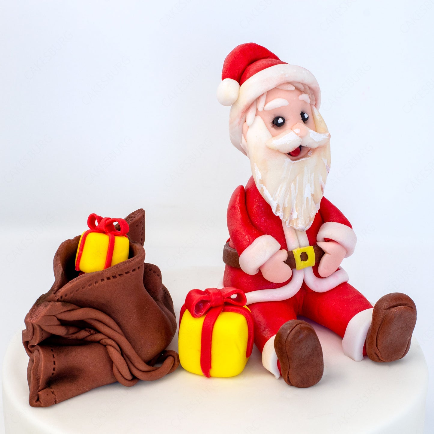 Edible Fondant Sitting Santa Clause with Gift Bag Cake Topper
